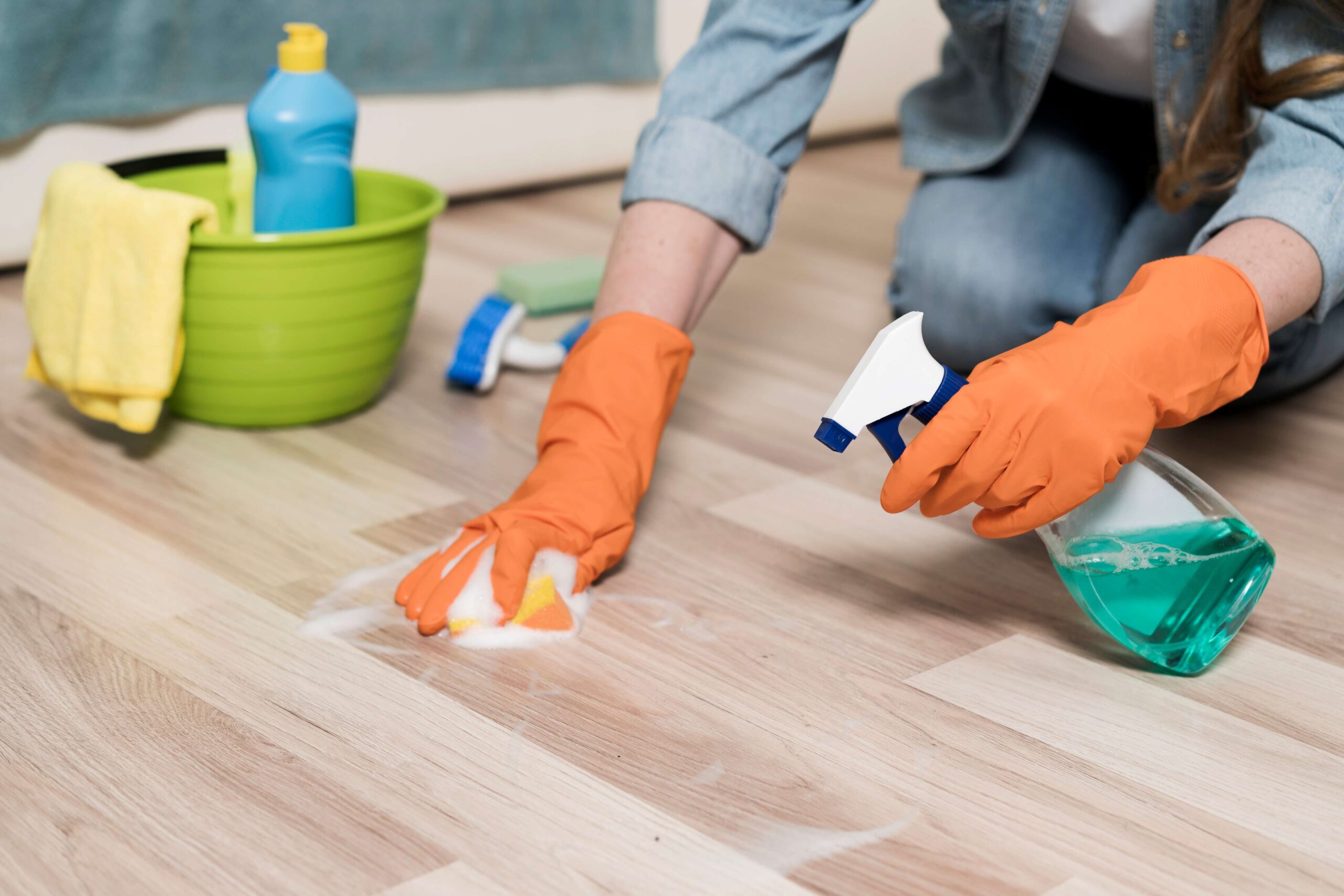 woman-with-rubber-gloves-cleaning-floors (1)