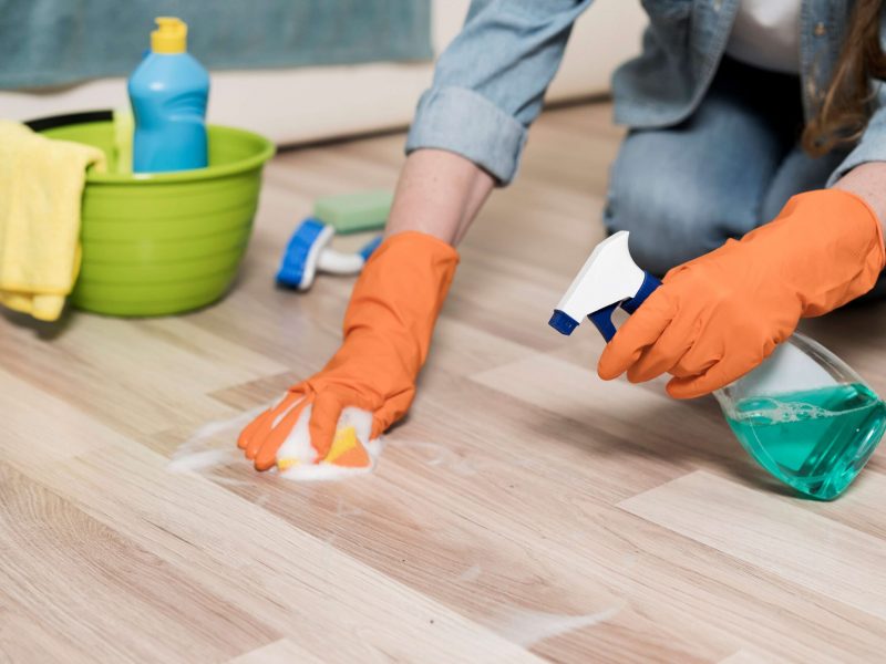 woman-with-rubber-gloves-cleaning-floors (1)
